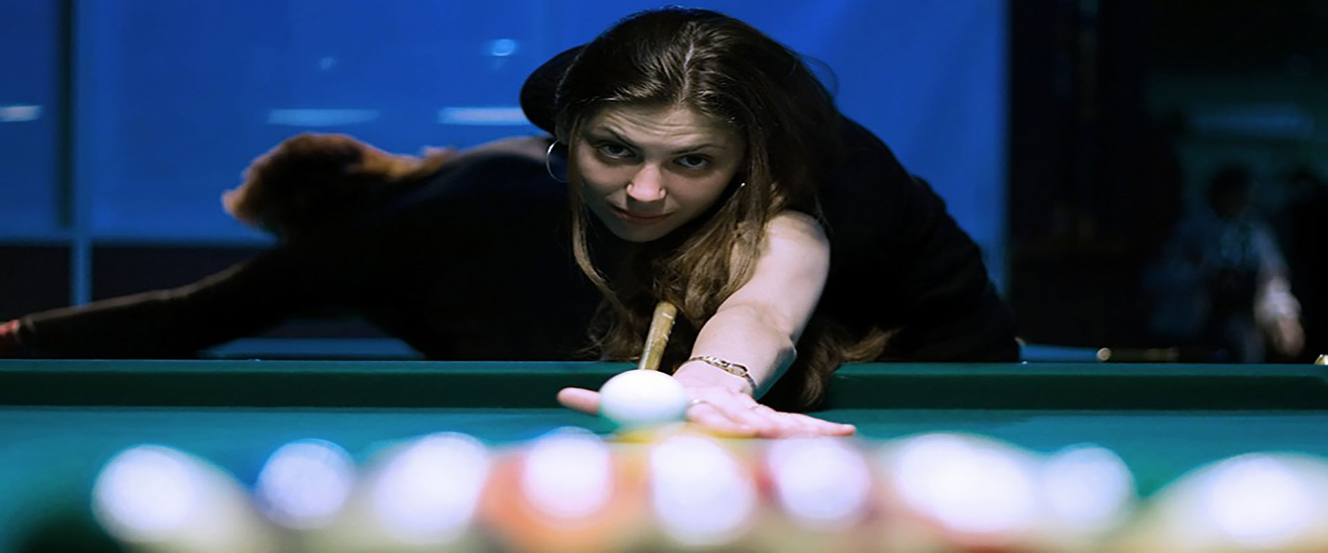 People playing Pool on Coin Operated bar pool tables